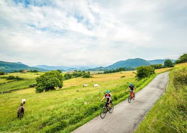 Two cyclists riding in the Basque Country region in northern Spain