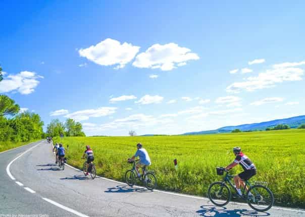 Group of cyclists on a guided cycling tour in Italy.jpg