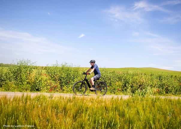 Cyclist on an electric bike tour in France from St Malo to Nice