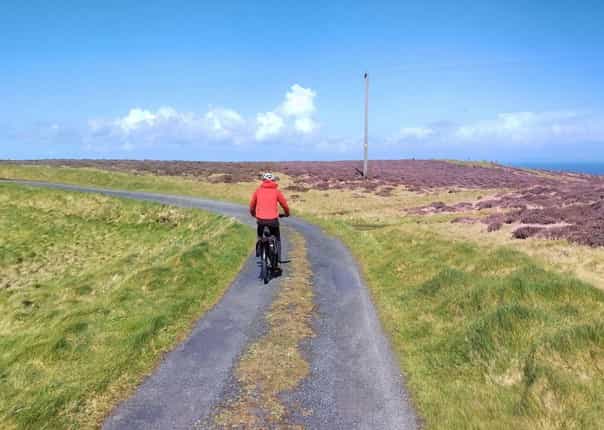 Cycling in Dumfries and Galloway through open moorland
