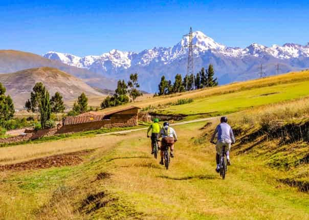 Group mountain biking in the Sacred Valley of the Incas on a guided tour in Peru