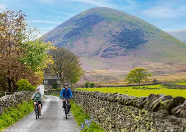 Two cyclists riding in the Lake District on the coast to coast C2C cycle route