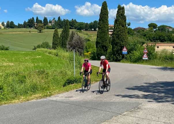 Two road cyclists cycling Italy coast to coast on a guided cycling tour